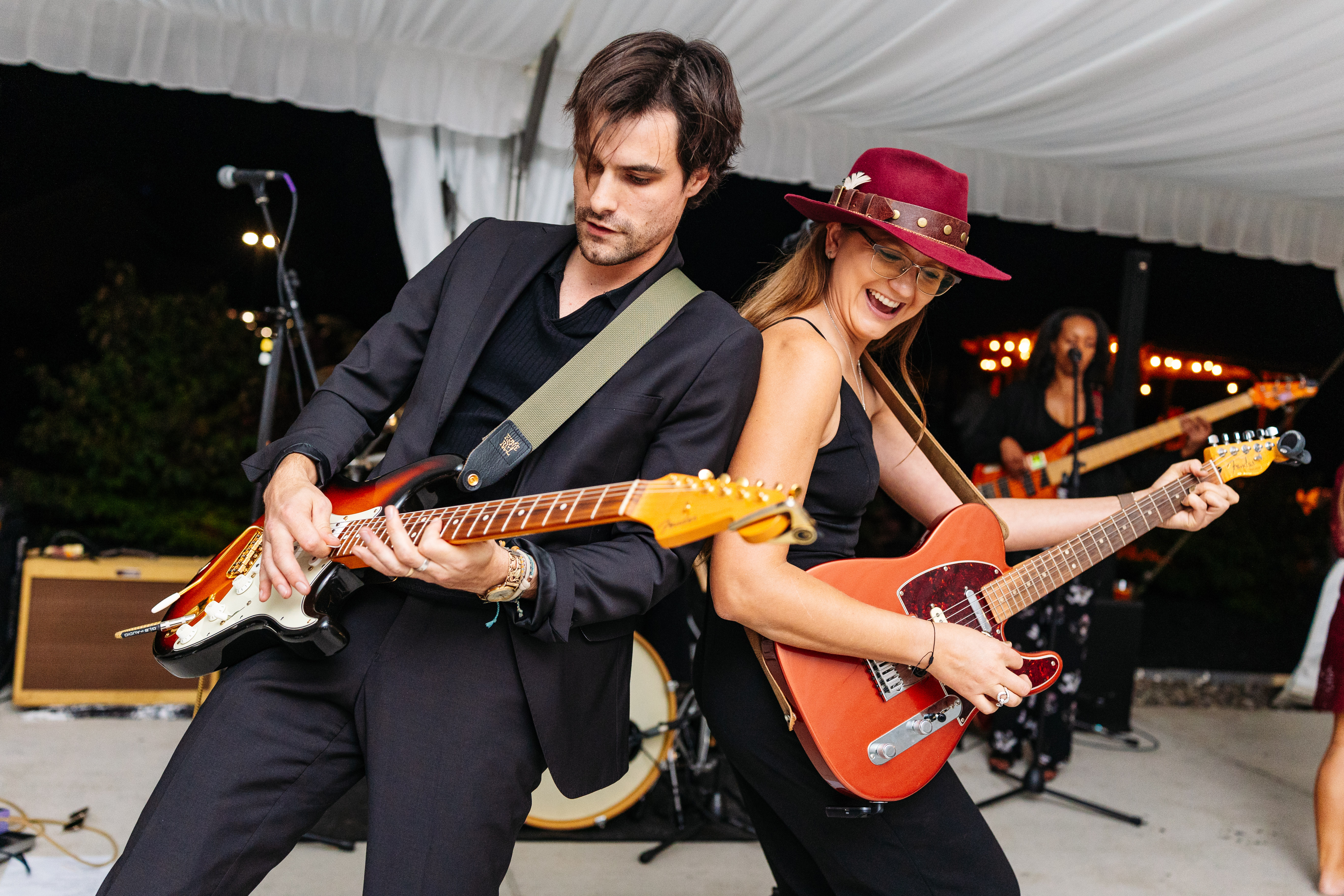 A photo of the guitar player and the singer performing during the ceremony